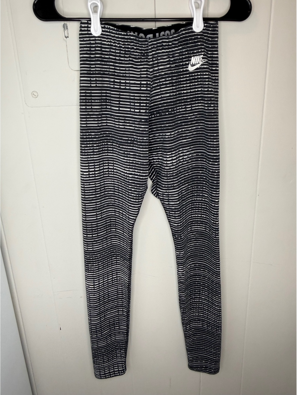 Nike Women's Black and White Striped Athletic Leggings with 'Just Do It' Waist